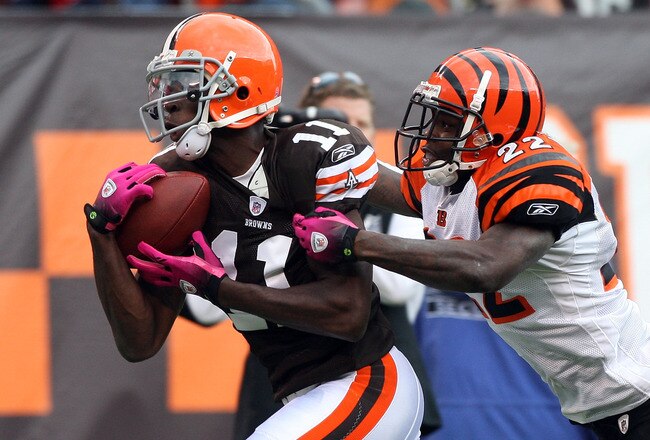 CLEVELAND - OCTOBER 04: Mohamed Massaquoi #11 of the Cleveland Browns makes a catch at the 1 yard line against Jonathan Joseph #22 of the Cincinnati Bengals during their game at Cleveland Browns Stadium on October 4, 2009 in Cleveland, Ohio.  (Photo by Jim McIsaac/Getty Images)