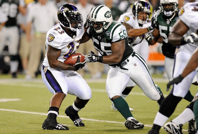 BALTIMORE - AUGUST 24:   Willis McGahee #23 of the Baltimore Ravens is tackled by Jamaal Westerman of the New York Jets during a preseason game at M&T Bank Stadium on August 24, 2009 in Baltimore, Maryland.  (Photo by Greg Fiume/Getty Images)
