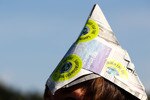 LONDON, ENGLAND - JUNE 28:  A spectator wearing a hat made of newspaper looks on on Day Seven of the Wimbledon Lawn Tennis Championships at the All England Lawn Tennis and Croquet Club on June 28, 2010 in London, England.  (Photo by Julian Finney/Getty Images)
