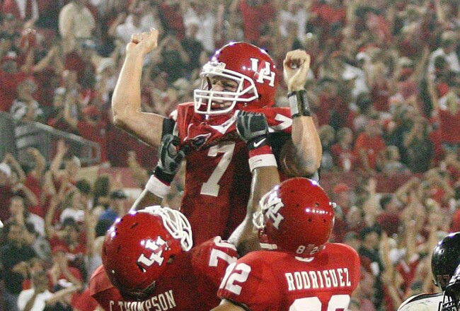 HOUSTON - SEPTEMBER 26: Quarterback Case Keenum #7 of the Houston Cougars is lifted in the air after Kennum scored a 4 yard touchdown run to give the Cougars a 29 to 28 win over the Texas Tech Red Raiders at Robertson Stadium on September 26, 2009 in Houston, Texas.  (Photo by Thomas B. Shea/Getty Images)