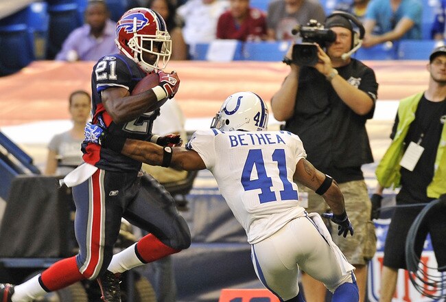 TORONTO, CANADA - AUGUST 19: C.J. Spiller #21 of the Buffalo Bills avoids the tackle of Antoine Bethea #41 of the Indianapolis Colts during game action August 19, 2010 at the Rogers Centre in Toronto, Ontario, Canada. (Photo by Brad White/Getty Images)
