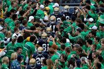 SOUTH BEND, IN - SEPTEMBER 04: Players from the Notre Dame Fighting Irish walk to the field through the student section for warm-ups before a game against the Purdue Boilermakers at Notre Dame Stadium on September 4, 2010 in South Bend, Indiana. Notre Dame defeated Purdue 23-12. (Photo by Jonathan Daniel/Getty Images)