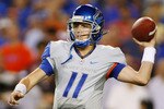 LANDOVER, MD - SEPTEMBER 06:  Quarterback Kellen Moore #11 of the Boise State Broncos passes against the Virginia Tech Hokies at FedExField on September 6, 2010 in Landover, Maryland.  (Photo by Geoff Burke/Getty Images)