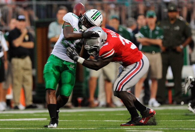 COLUMBUS, OH - SEPTEMBER 2:  Brian Rolle #36 of the Ohio State Buckeyes hits Martin Ward #29 of the Marshall Thundering Herd jarring the ball loose for an incomplete pass at Ohio Stadium on September 2, 2010 in Columbus, Ohio.  (Photo by Jamie Sabau/Getty Images)