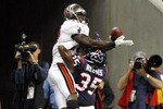 HOUSTON - SEPTEMBER 02:  Wide receiver Arrelious Benn #17 of the Tampa Bay Buccaneers leaps over cornerback Jacques Reeves #35 of the Houston Texans for a touchdown in the fourth quarter at Reliant Stadium on September 2, 2010 in Houston, Texas.  (Photo by Bob Levey/Getty Images)