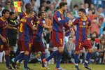 SANTANDER, SPAIN - AUGUST 29:  David Villa (R) of Barcelona celebrates with teammates after scoring Barcelona's third goal during the La Liga match between Racing Santander and Barcelona at El Sardinero stadium on August 29, 2010 in Santander, Spain.  (Photo by Denis Doyle/Getty Images)