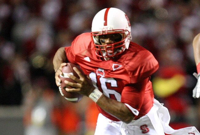 RALEIGH, NC - SEPTEMBER 3:  Quarterback Russell Wilson #16 of the North Carolina State Wolfpack scrambles for yards after avoiding the tackle by Nathan Pepper #95 of the South Carolina Gamecocks during the game at Carter-Finley Stadium on September 3, 2009 in Raleigh, North Carolina. (Photo by Streeter Lecka/Getty Images)