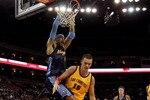 OAKLAND, CA - JANUARY 20:  Kenyon Martin #4 of the Denver Nuggets dunks on Andris Biedrins #15 of the Golden State Warriors at Oracle Arena on January 20, 2010 in Oakland, California.  NOTE TO USER: User expressly acknowledges and agrees that, by downloading and/or using this Photograph, user is consenting to the terms and conditions of the Getty Images License Agreement.  (Photo by Ezra Shaw/Getty Images)