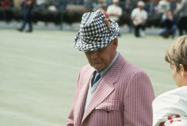 Coach Bear Bryant of the Alabama Crimson Tide watches his players during a game.