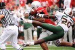 COLUMBUS, OH - SEPTEMBER 11:  Cameron Heyward #97 of the Ohio State Buckeyes steps in front of Damien Berry #20 of the Miami Hurricanes to intercept a pass at Ohio Stadium on September 11, 2010 in Columbus, Ohio. Ohio State intercepted Miami four times en route to a 36-24 win.  (Photo by Jamie Sabau/Getty Images)