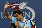 NEW YORK - SEPTEMBER 11:  Roger Federer of Switzerland waves to fans as he leaves the court after losing to Novak Djokovic of Serbia during the men's singles semifinal match on day thirteen of the 2010 U.S. Open at the USTA Billie Jean King National Tennis Center on September 11, 2010 in the Flushing neighborhood of the Queens borough of New York City.  (Photo by Jim McIsaac/Getty Images)