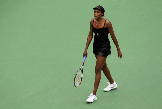 NEW YORK - SEPTEMBER 10:  Venus Williams of the United States reacts after a point played against Kim Clijsters of Belgium during her women's semifinal match on day twelve of the 2010 U.S. Open at the USTA Billie Jean King National Tennis Center on September 10, 2010 in the Flushing neighborhood of the Queens borough of New York City. Clijsters defeated Williams 4-6, 7-6(2), 6-4.  (Photo by Chris McGrath/Getty Images)