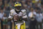 SOUTH BEND, IN - SEPTEMBER 11: Denard Robinson #16 of the Michigan Wolverines looks for a receiver against the Notre Dame Fighting Irish at Notre Dame Stadium on September 11, 2010 in South Bend, Indiana. Michigan defeated Notre Dame 28-24.  (Photo by Jonathan Daniel/Getty Images)