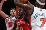 NEW YORK - MARCH 19:  Jrue Holiday #11 of the Philadelphia 76ers lays the ball up in between Al Harrington #7 and Danilo Gallinari #8 of the New York Knicks at Madison Square Garden on March 19, 2010 in New York City. NOTE TO USER: User expressly acknowledges and agrees that, by downloading and or using this photograph, User is consenting to the terms and conditions of the Getty Images License Agreement.  (Photo by Nick Laham/Getty Images)