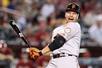 PHOENIX - SEPTEMBER 06:  Cody Ross #13 of the San Francisco Giants reacts after being hit by a pitch during the tenth inning of the Major League Baseball game against the Arizona Diamondbacks at Chase Field on September 6, 2010 in Phoenix, Arizona. The Giants defeated the Diamondbacks 2-0 in eleven innings. (Photo by Christian Petersen/Getty Images)