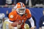 TAMPA, FL - NOVEMBER 28: Quarterback Kyle Parker #11 of the Clemson Tigers rushes upfield against the Georgia Tech Yellow Jackets in the 2009 ACC Football Championship Game December 5, 2009 at Raymond James Stadium in Tampa, Florida.  (Photo by Al Messerschmidt/Getty Images)