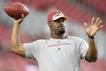 GLENDALE, AZ - SEPTEMBER 02:  Quarterback Donovan McNabb #5 of the Washington Redskins warms up before the preseason NFL game against the Arizona Cardinals at the University of Phoenix Stadium on September 2, 2010 in Glendale, Arizona.  (Photo by Christian Petersen/Getty Images)