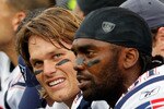 FOXBORO, MA - SEPTEMBER 12: Quarterback Tom Brady #12 and Randy Moss #81 of the New England Patriots take a breather on the bench during the NFL season opener against the Cincinnati Bengals at Gillette Stadium on September 12, 2010 in Foxboro, Massachusetts. (Photo by Jim Rogash/Getty Images)