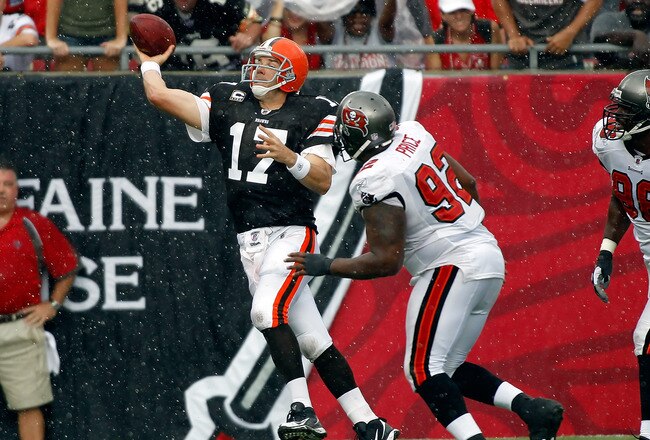TAMPA, FL - SEPTEMBER 12:  Quarterback Jake Delhomme #17 of the Cleveland Browns throws a pass as defensive tackle Brian Price #92 of the Tampa Bay Buccaneers closes in during the game at Raymond James Stadium on September 12, 2010 in Tampa, Florida.  (Photo by J. Meric/Getty Images)