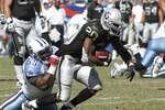 NASHVILLE - SEPTEMBER 12: Stephen Tulloch #55 of the Tennessee Titans tackles Darren McFadden #20 of the Oakland Raiders during the NFL season opener at LP Field on September 12, 2010 in Nashville, Tennessee. The Titans defeated the Raiders 38-13. (Photo by Joe Robbins/Getty Images)