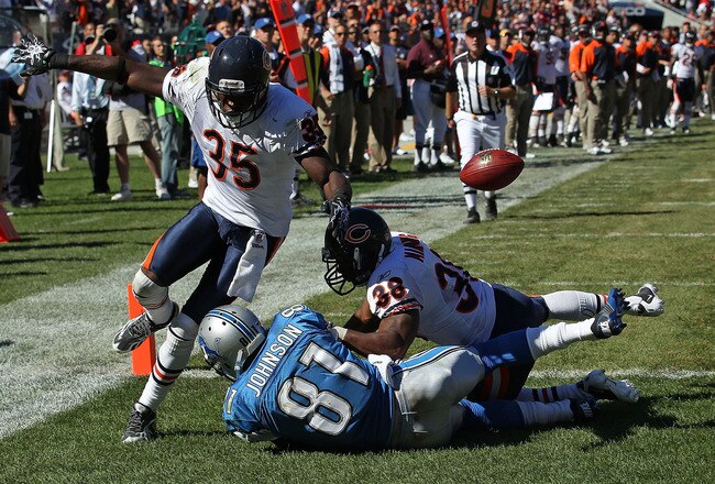 CHICAGO - SEPTEMBER 12: Zack Bowman #35 and Danieal Manning #38 of the Chicago Bears break up a pass intended for Calvin Johnson #81 of the Detroit Lions during the NFL season opening game at Soldier Field on September 12, 2010 in Chicago, Illinois. The Bears defeated the Lions 19-14. (Photo by Jonathan Daniel/Getty Images)