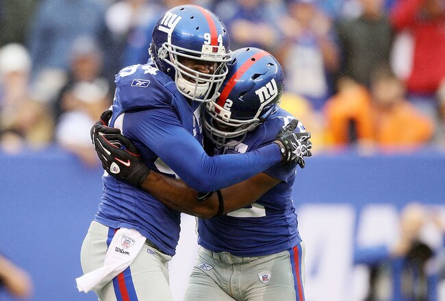 EAST RUTHERFORD, NJ - SEPTEMBER 12:  Mathias Kiwanuka #94 of the New York Giants celebrates a fourth quarter sack against the Carolina Panthers with teammate Osi Umenyiora #72 on September 12, 2010 at the New Meadowlands Stadium in East Rutherford, New Jersey. The Giants defeated the Panthers 31-18.  (Photo by Jim McIsaac/Getty Images)