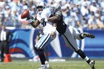 NASHVILLE - SEPTEMBER 12: Vince Young #10 of the Tennessee Titans gets sacked by Kamerion Wimbley #96 of the Oakland Raiders in the first half of the NFL season opener at LP Field on September 12, 2010 in Nashville, Tennessee. (Photo by Joe Robbins/Getty Images)