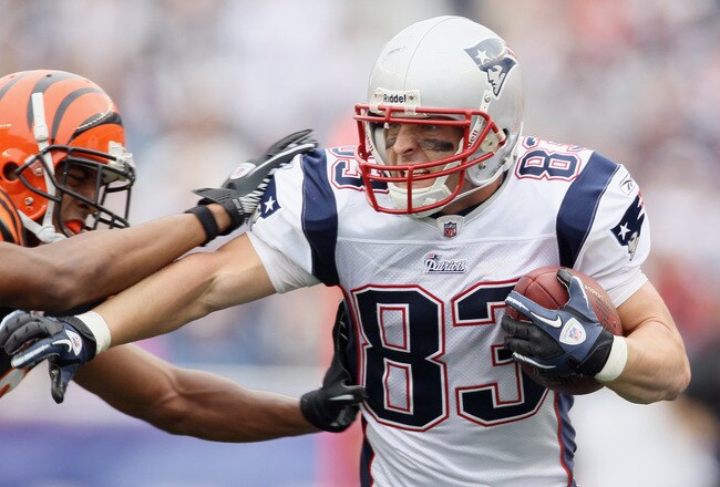 FOXBORO, MA - SEPTEMBER 12:  Wes Welker #83 of the New England Patriots carries the ball as Leon Hall #29 of the Cincinnati Bengals defends during the NFL season opener on September 12, 2010 at Gillette Stadium in Foxboro, Massachusetts. The Patriots defeated the Bengals 38-24.  (Photo by Elsa/Getty Images)