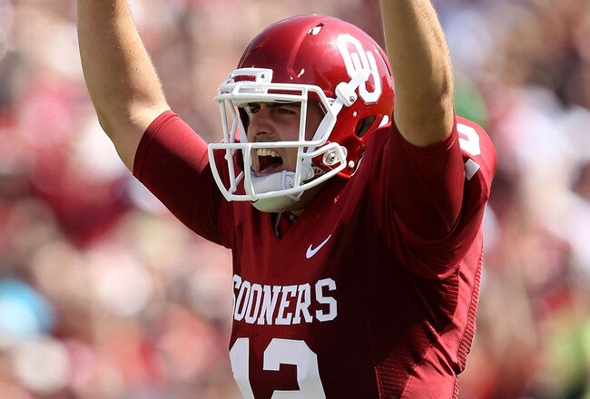 NORMAN, OK - SEPTEMBER 11:  Quarterback Landry Jones #12 of the Oklahoma Sooners celebrates a touchdown against the Florida State Seminoles in the first quarter at Gaylord Family Oklahoma Memorial Stadium on September 11, 2010 in Norman, Oklahoma.  (Photo by Ronald Martinez/Getty Images)