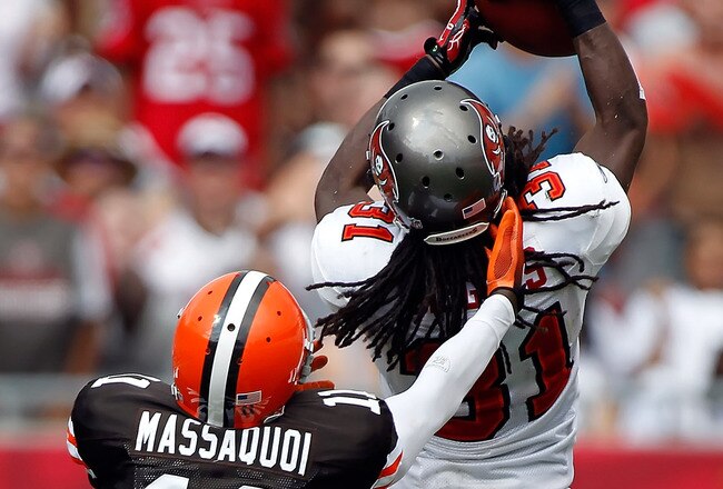 TAMPA, FL - SEPTEMBER 12:  Cornerback E.J. Biggers #31 of the Tampa Bay Buccaneers intercepts a pass intended for receiver Mohamed Massaquoi #11 of the Cleveland Browns during the NFL season opener game at Raymond James Stadium on September 12, 2010 in Tampa, Florida.  (Photo by J. Meric/Getty Images)