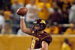 MINNEAPOLIS - NOVEMBER 01:  Adam Weber #8 of the Minnesota Golden Gophers fakes a pass down field as he scrambles out of  the pocket against the Northwestern Wildcats during the third quarter at the Hubert H.Humphrey Metrodome on November 1, 2008 in Minneapolis, Minnesota.  (Photo by Harry How/Getty Images)