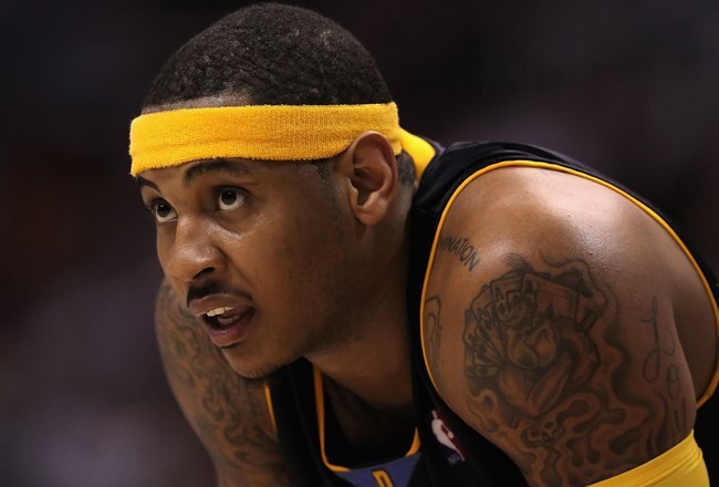 PHOENIX - APRIL 13:  Carmelo Anthony #15 of the Denver Nuggets in action during the NBA game against the Phoenix Suns at US Airways Center on April 13, 2010 in Phoenix, Arizona. The Suns defeated the Nuggets 123-101.  NOTE TO USER: User expressly acknowledges and agrees that, by downloading and or using this photograph, User is consenting to the terms and conditions of the Getty Images License Agreement.  (Photo by Christian Petersen/Getty Images)