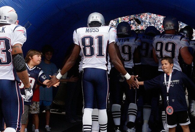 FOXBORO, MA - SEPTEMBER 12: Randy Moss #81 of the New England Patriots enters the field before the NFL season opener against the Cincinnati Bengals at Gillette Stadium on September 12, 2010 in Foxboro, Massachusetts. (Photo by Jim Rogash/Getty Images)