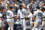 NEW YORK - JULY 24:  Sergio Mitre #45 of the New York Yankees hands the ball to manager Joe Girardi #28 and leaves the game in the fifth inning against the Kansas City Royals at Yankee Stadium on July 24, 2010 in the Bronx borough of New York City.  (Photo by Nick Laham/Getty Images)