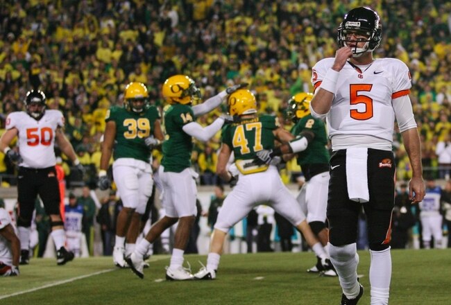 EUGENE,OR - DECEMBER 03: Quarterback Sean Canfield #47 of the Oregon State Beavers walks off the field after teammate Jacquizz Rodgers #1 is tackled by Kiko Alonso #47 of the Oregon Ducks during the second quarter of the game at Autzen Stadium on December 3, 2009 in Eugene, Oregon.  (Photo by Tom Hauck/Getty Images)