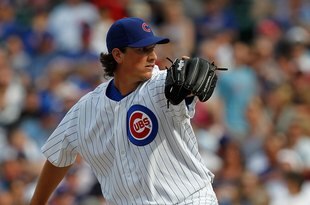 CHICAGO - APRIL 15: Jeff Samardzija of the Chicago Cubs, wearing a number 42 jersey in honor of Jackie Robinson, delivers the ball against the Milwaukee Brewers at Wrigley Field on April 15, 2010 in Chicago, Illinois. The Brewers defeated the Cubs 8-6. (Photo by Jonathan Daniel/Getty Images)