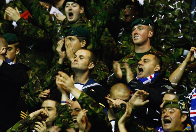 GLASGOW, SCOTLAND - OCTOBER 20:  Members of the armed forces react during the UEFA Champions League Group G match between Rangers and Unirea Urziceni at Ibrox Stadium on October 20, 2009 in Glasgow, Scotland.  (Photo by Jeff J Mitchell/Getty Images)