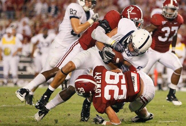 TUSCALOOSA, AL - SEPTEMBER 11:  Dre Kirkpatrick #21 and Will Lowery #29 of the Alabama Crimson Tide tackle Derek Moye #6 of the Penn State Nittany Lions at Bryant-Denny Stadium on September 11, 2010 in Tuscaloosa, Alabama.  (Photo by Kevin C. Cox/Getty Images)