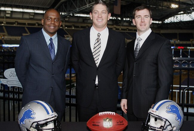 DETROIT , MI - JANUARY 16:  Jim Schwartz, center, head coach of the Detroit Lions poses with General Manager Martin Mayhew, left, and Tom Lewand team president after a press conference to introduce him as the Lions new head coach on January 16, 2009 at Ford Field in Detroit, Michigan.  (Photo by Gregory Shamus/Getty Images)