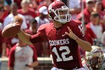 NORMAN, OK - SEPTEMBER 11:  Quarterback Landry Jones #12 of the Oklahoma Sooners drops back to pass against the Florida State Seminoles in the first quarter at Gaylord Family Oklahoma Memorial Stadium on September 11, 2010 in Norman, Oklahoma.  (Photo by Ronald Martinez/Getty Images)