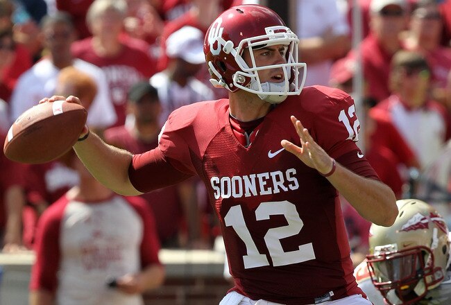 NORMAN, OK - SEPTEMBER 11:  Quarterback Landry Jones #12 of the Oklahoma Sooners drops back to pass against the Florida State Seminoles in the first quarter at Gaylord Family Oklahoma Memorial Stadium on September 11, 2010 in Norman, Oklahoma.  (Photo by Ronald Martinez/Getty Images)