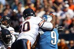 CHICAGO - SEPTEMBER 12: Julius Peppers #90 of the Chicago Bears hits Matthew Stafford #9 of the Detroit Lions in the head earning a penalty during the NFL season opening game at Soldier Field on September 12, 2010 in Chicago, Illinois. The Bears defeated the Lions 19-14. (Photo by Jonathan Daniel/Getty Images)