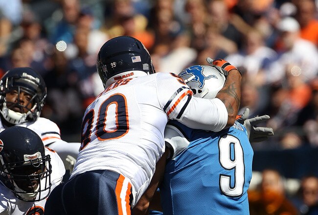 CHICAGO - SEPTEMBER 12: Julius Peppers #90 of the Chicago Bears hits Matthew Stafford #9 of the Detroit Lions in the head earning a penalty during the NFL season opening game at Soldier Field on September 12, 2010 in Chicago, Illinois. The Bears defeated the Lions 19-14. (Photo by Jonathan Daniel/Getty Images)