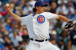 CHICAGO - APRIL 12: Jeff Samardzija #29 of the Chicago Cubs pitches against the Milwaukee Brewers on Opening Day at Wrigley Field on April 12, 2010 in Chicago, Illinois. The Cubs defeated the Brewers 9-5.  (Photo by Jonathan Daniel/Getty Images)