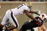 LOUISVILLE, KY - OCTOBER 02:  Adam Froman #9 of the Louisville Cardinals is sacked by Greg Romeus #91  of the Pittsburgh Panthers during the Big East Conference game at Papa John's Cardinal Stadium on October 2, 2009 in Louisville, Kentucky.  (Photo by Andy Lyons/Getty Images)