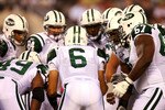 EAST RUTHERFORD, NJ - SEPTEMBER 13:  Mark Sanchez #6 of the New York Jets talks to his teammates in a huddle against the Baltimore Ravens during their home opener at the New Meadowlands Stadium on September 13, 2010 in East Rutherford, New Jersey.  (Photo by Andrew Burton/Getty Images)