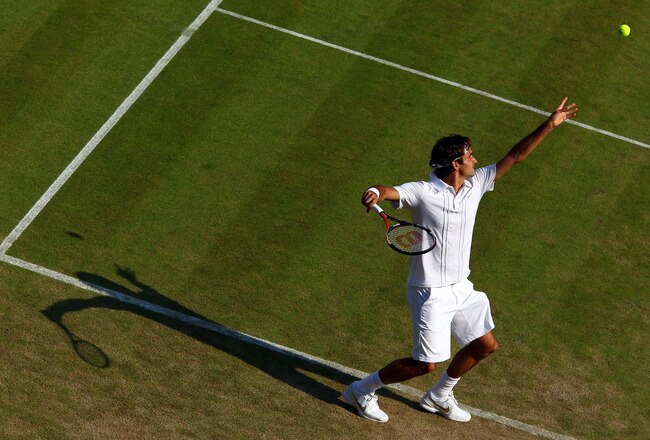 LONDON, ENGLAND - JUNE 23:  Roger Federer of Switzerland serves during his second round match against Ilija Bozoljac of Serbia on Day Three of the Wimbledon Lawn Tennis Championships at the All England Lawn Tennis and Croquet Club on June 23, 2010 in London, England.  (Photo by Clive Brunskill/Getty Images)