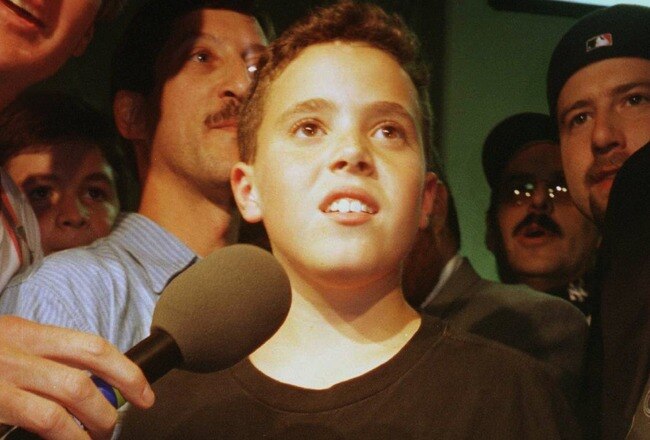 9 Oct 1996: An interviewer speaks to Yankees fan Jeffrey Maier, the twelve year old who caught a fly ball to right field over outfielder Tony Tarasco of the Baltimore Orioles that was ruled a home run in a controversial decision during the first game of t