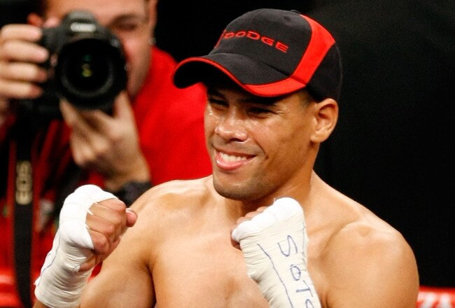 LAS VEGAS - DECEMBER 06:  (L-R) Juan Manuel Lopez of Puerto Rico celebrates after defeating Sergio Medina of Argentina during their WBO junior featherweight title fight at the MGM Grand Garden Arena December 6, 2008 in Las Vegas, Nevada.  (Photo by Ethan Miller/Getty Images)