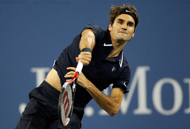 NEW YORK - SEPTEMBER 08:  Roger Federer of Switzerland serves against Robin Soderling of Sweden during his men's singles quarterfinal match on day ten of the 2010 U.S. Open at the USTA Billie Jean King National Tennis Center on September 8, 2010 in the Flushing neighborhood of the Queens borough of New York City.  (Photo by Matthew Stockman/Getty Images)